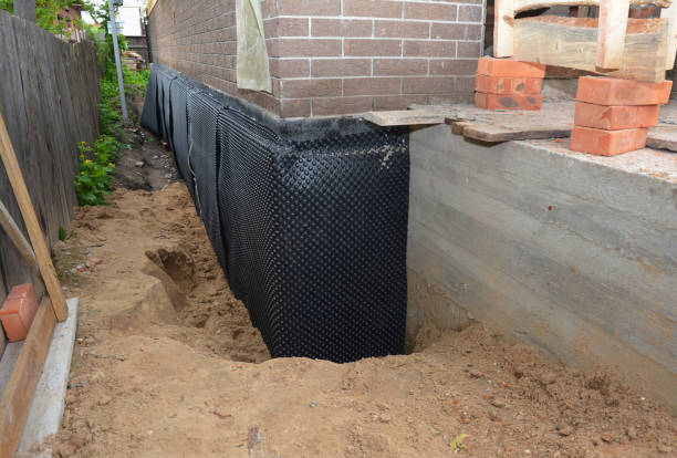 Happy homeowners after waterproofing job in Fenwick